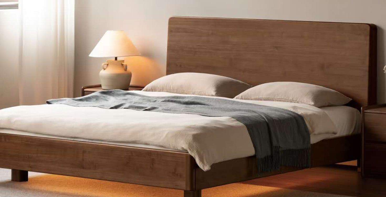 Solid walnut bed frame in a Kiwi bedroom