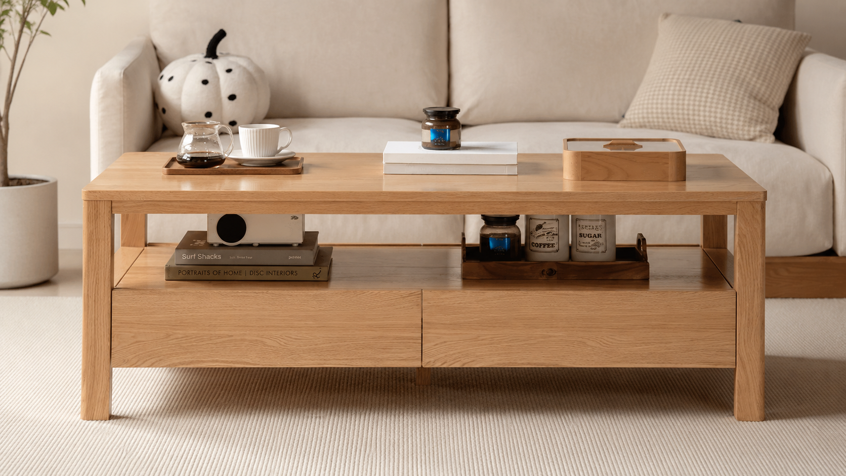 Solid oak coffee table styled with a side cabinet and fabric sofa in a warm New Zealand living room