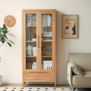 a living room with a chair and a book case