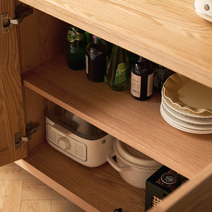 a kitchen cabinet with plates and bowls in it