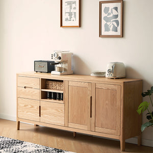 a wooden cabinet with a coffee maker on top of it