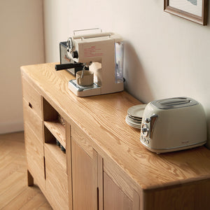 a toaster sitting on top of a wooden counter