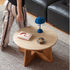 Anela natural solid cherry coffee table set with travertine-look sintered stone top in a modern organic Kiwi living room