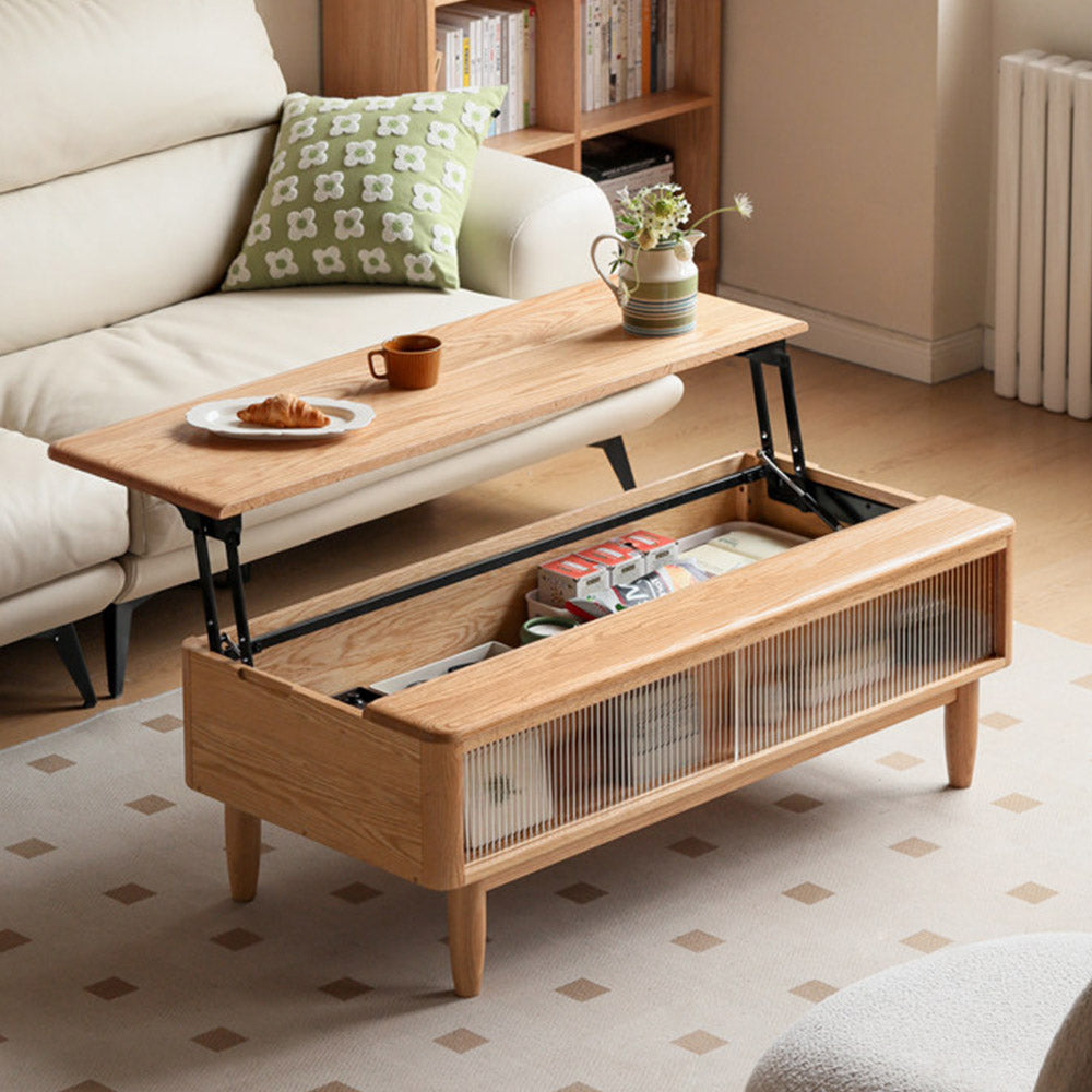 Anzio natural solid oak lift-top coffee table with hidden storage compartment and glass sliding door shelf in a modern living room