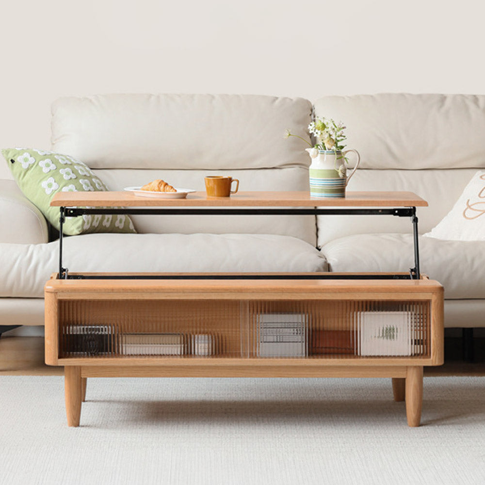 Anzio natural solid oak lift-top coffee table with hidden storage compartment and glass sliding door shelf in a modern living room