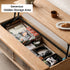 Anzio natural solid oak lift-top coffee table with hidden storage compartment and glass sliding door shelf in a modern living room