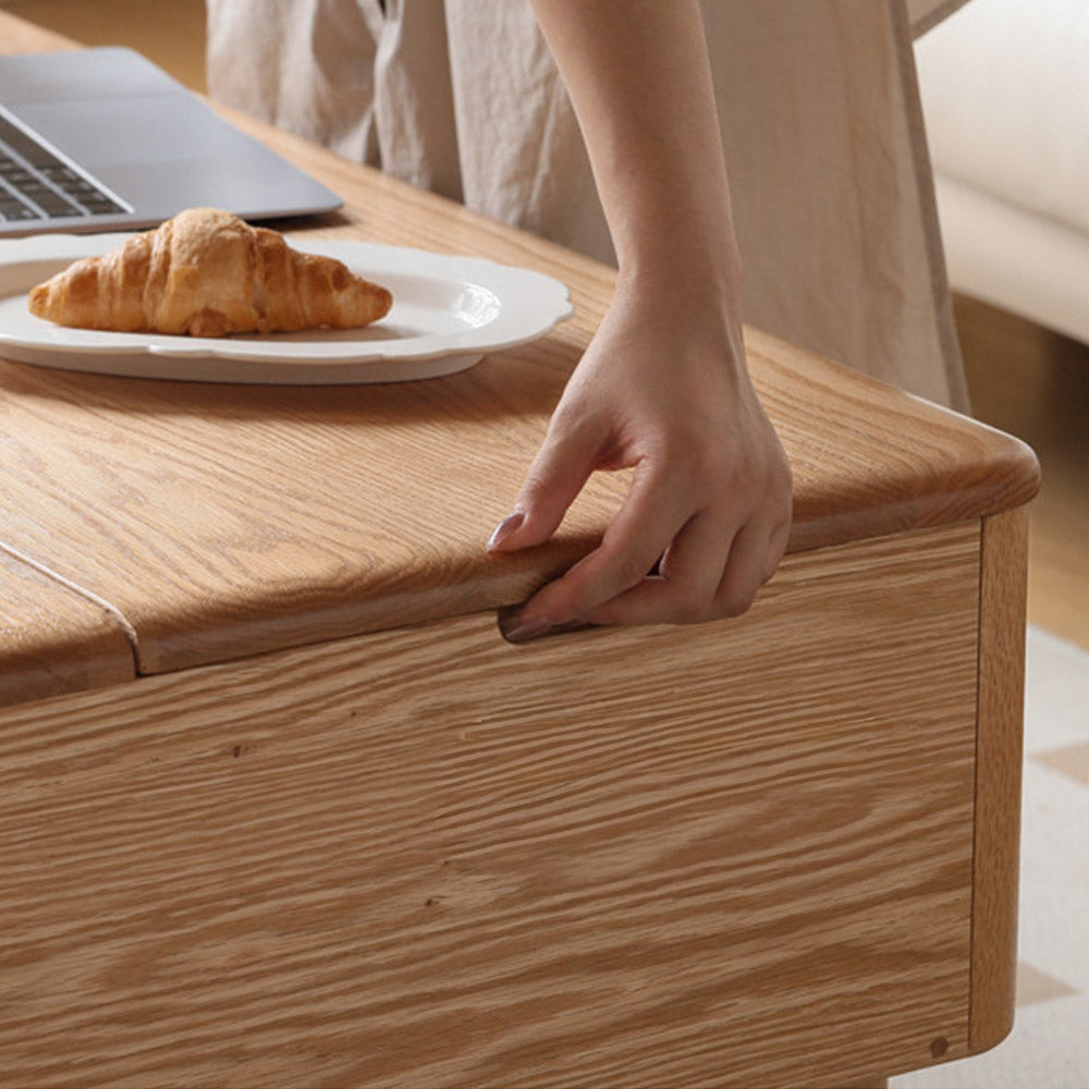 Anzio natural solid oak lift-top coffee table with hidden storage compartment and glass sliding door shelf in a modern living room