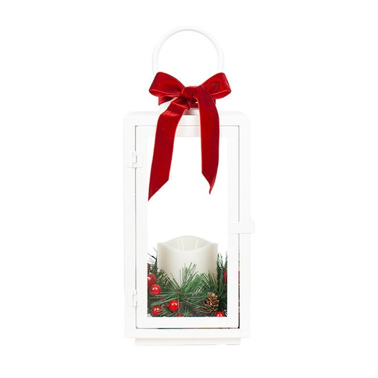 Small white Christmas LED lantern with red velvet bow, candle, pine greenery and festive red berries