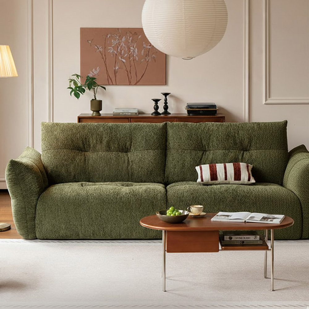 Blancas green chenille sofa with deep cushioned seating and vintage-inspired design in a modern living room.