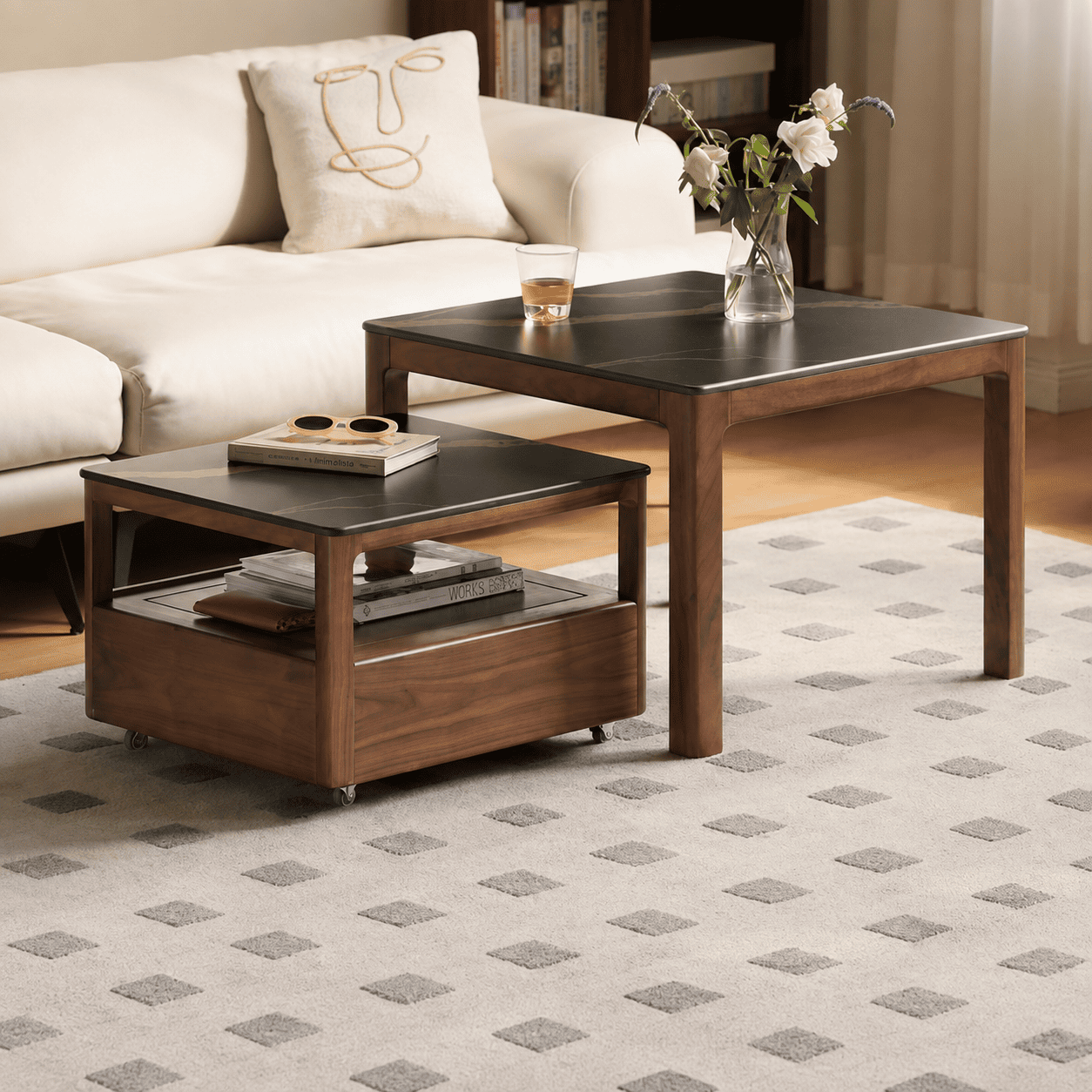 Solid walnut nesting coffee table set with black ceramic tops and living room sofa