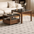 Solid walnut nesting coffee table set with black ceramic tops and living room sofa