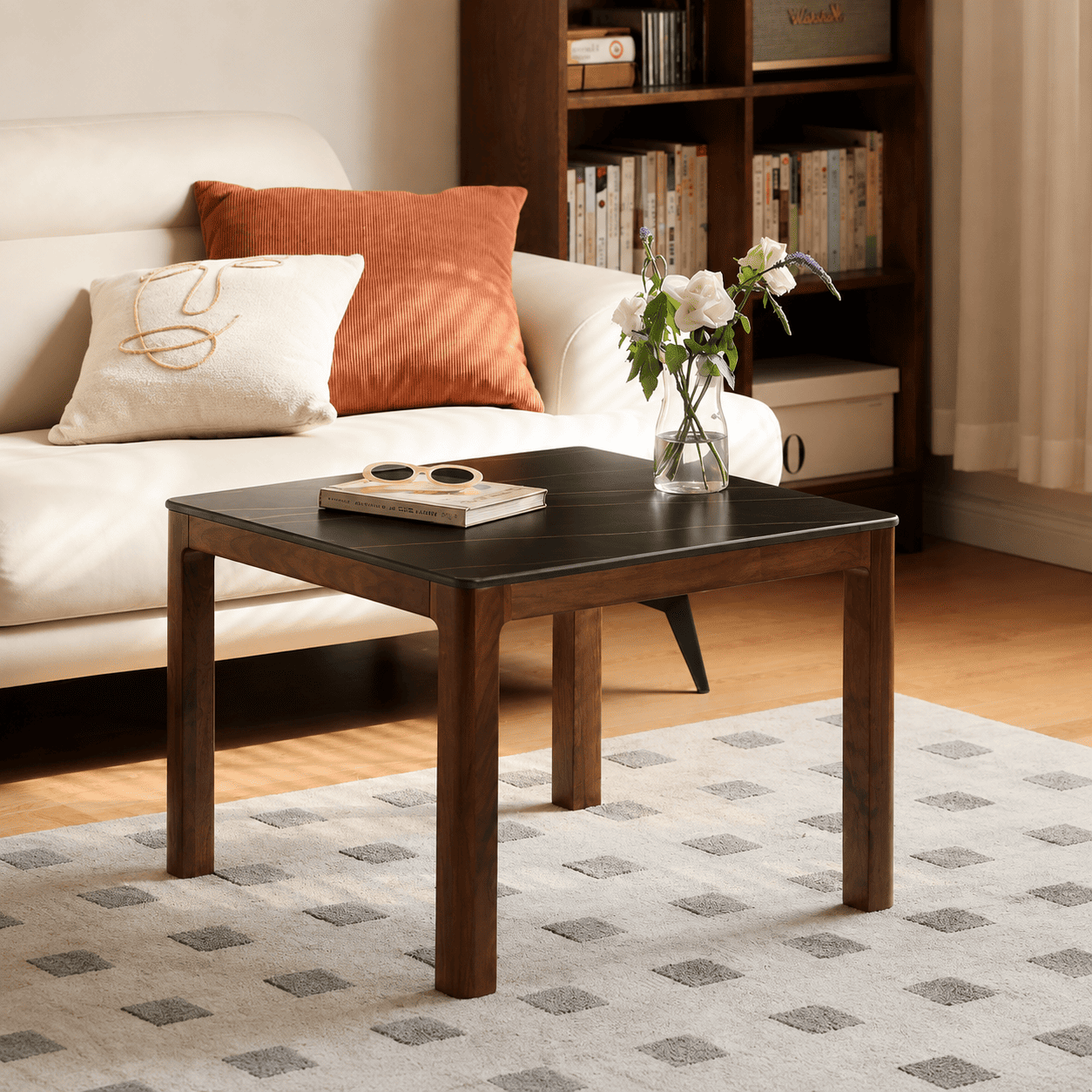 Close-up of Boise coffee table ceramic top, walnut frame and rounded corner detail