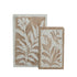 Set of two beige and brown decorative book boxes with botanical leaf print covers