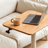 Close up of Cary solid oak movable desk tabletop with laptop, mug and height adjustment handle