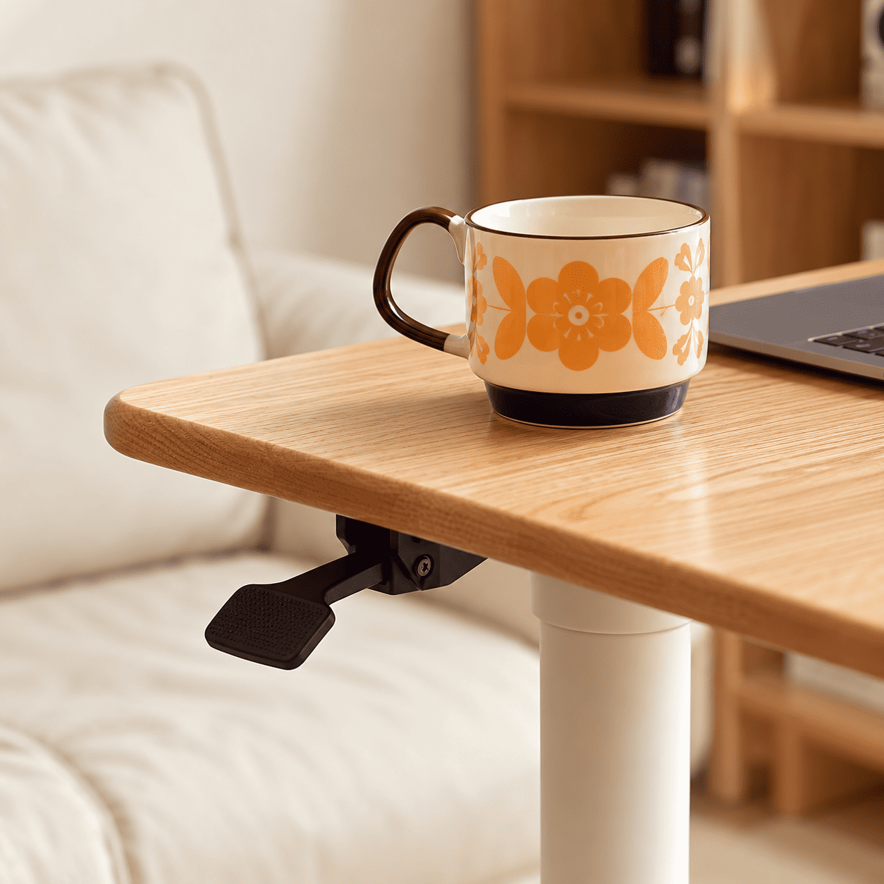 Close up of Cary movable desk rounded solid oak tabletop edge and height adjustment lever