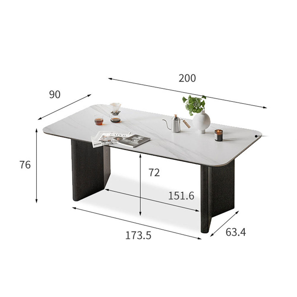 Charcoal solid oak dining table with white marble-look ceramic top and black pedestal legs, styled with dining chairs in a modern dining room.