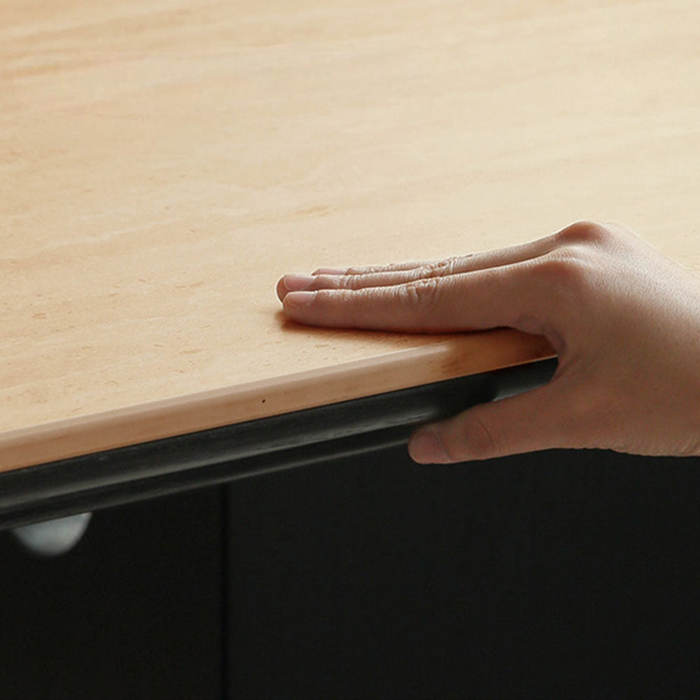 Charcoal solid oak dining table with travertine-look ceramic top and mid-century dot-detail legs, styled with dining chairs in a modern dining room.