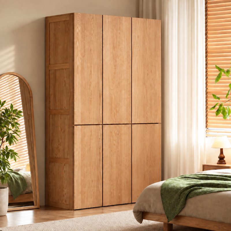 Clovis natural solid oak wardrobe closed in warm modern bedroom setting