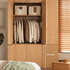 Clovis natural oak wardrobe open with hanging clothes, top shelves and 102.5 cm door section