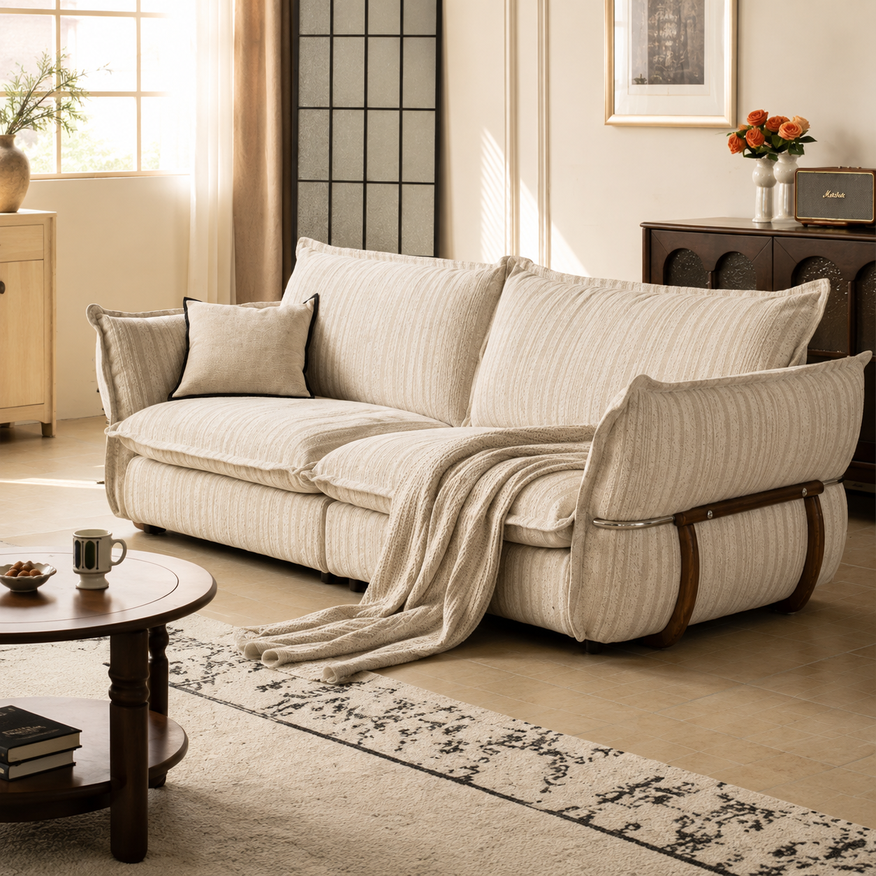 Cream striped fabric sofa with deep cushioned seating styled in a warm contemporary living room.