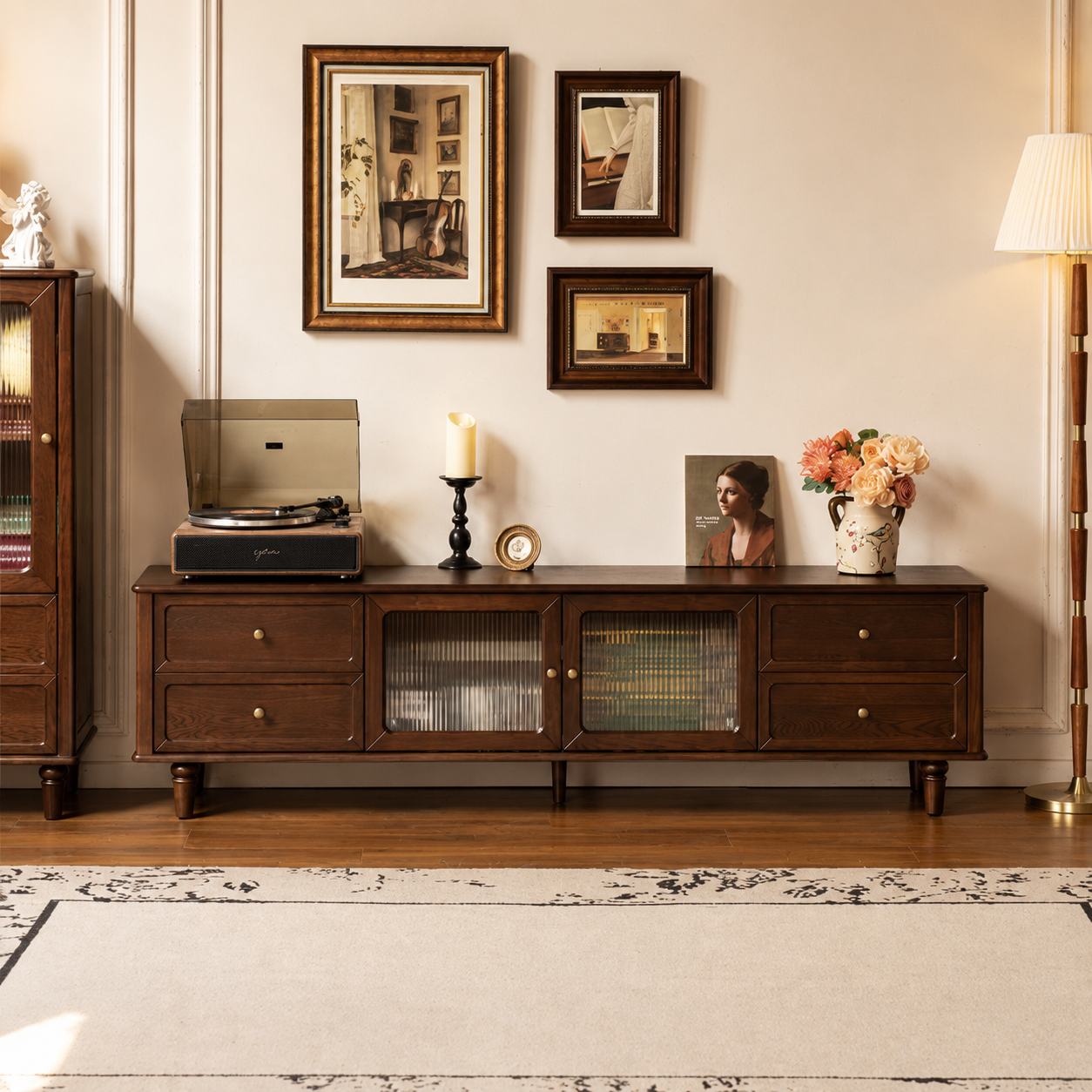 Dark wood TV unit with four drawers, two fluted glass cabinet doors and raised legs in a warm living room.
