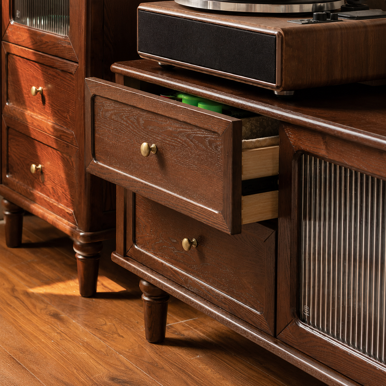Dark wood TV unit with open drawers showing practical interior storage and smooth drawer runners.