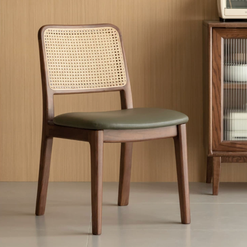 Solid walnut dining chair with warm wood grain and padded leather seat design