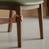 Natural solid walnut dining chair with cushioned leather pad and curved timber backrest