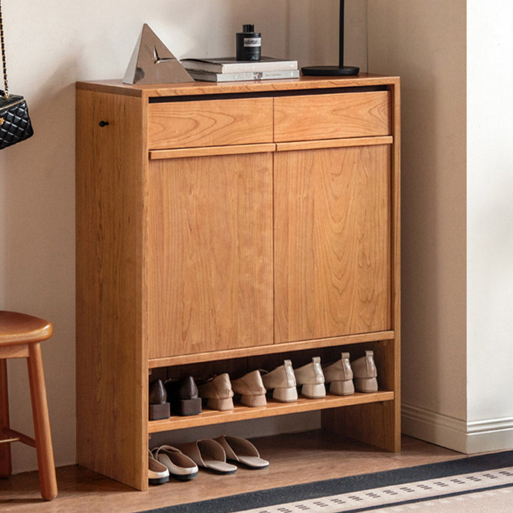 Enna natural solid cherry shoe cabinet with drawers, adjustable shoe racks, open shelves and side hooks in a hallway setting