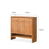 Enna natural solid cherry shoe cabinet with drawers, adjustable shoe racks, open shelves and side hooks in a hallway setting