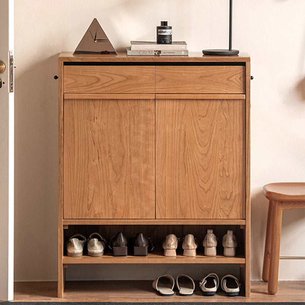 Enna natural solid cherry shoe cabinet with drawers, adjustable shoe racks, open shelves and side hooks in a hallway setting