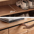 Enna natural solid oak shoe cabinet with drawers, adjustable internal shoe racks, open shelves and side hooks in an entryway