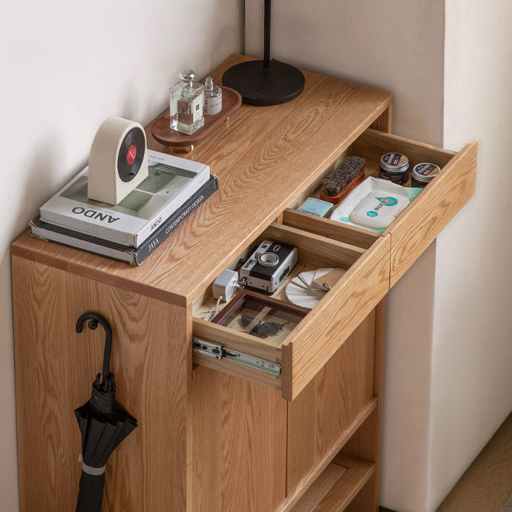 Enna natural solid oak shoe cabinet with drawers, adjustable internal shoe racks, open shelves and side hooks in an entryway