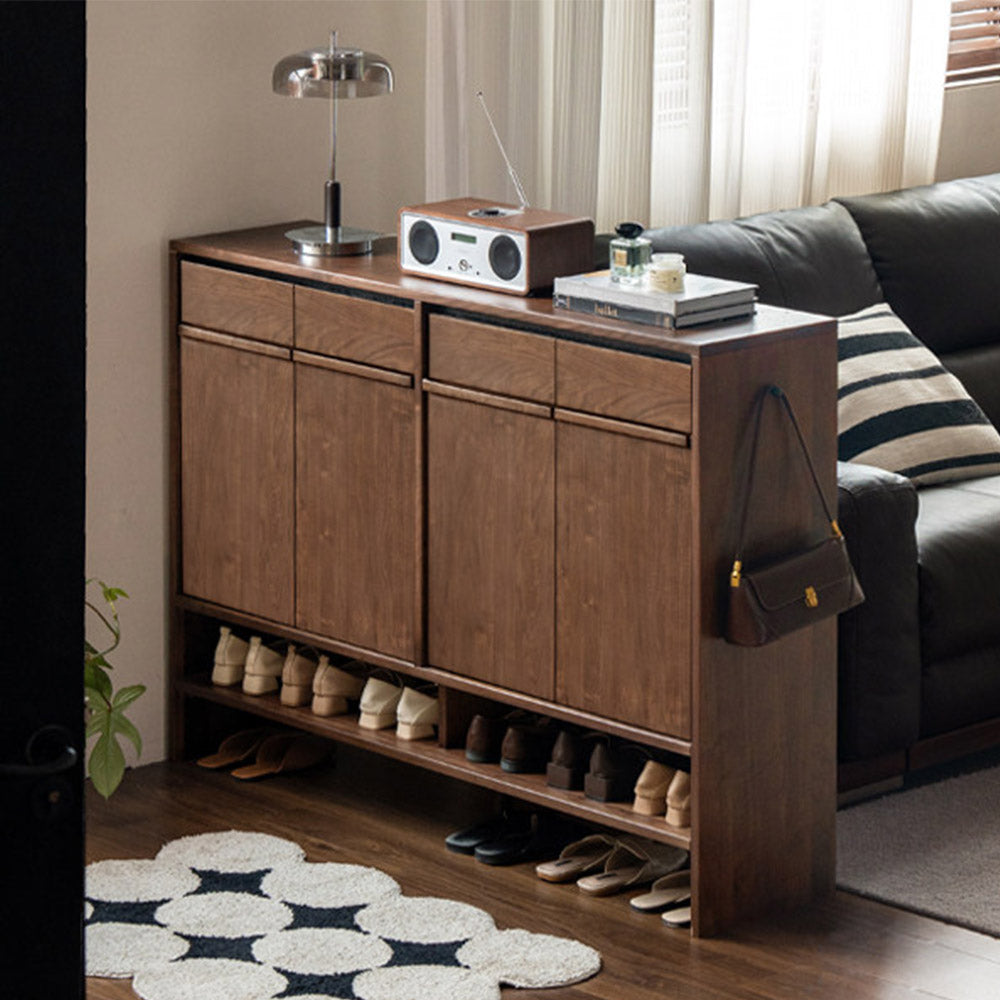Enna natural solid walnut shoe cabinet with drawers, adjustable internal shoe racks, open shelves and side hooks in an entryway