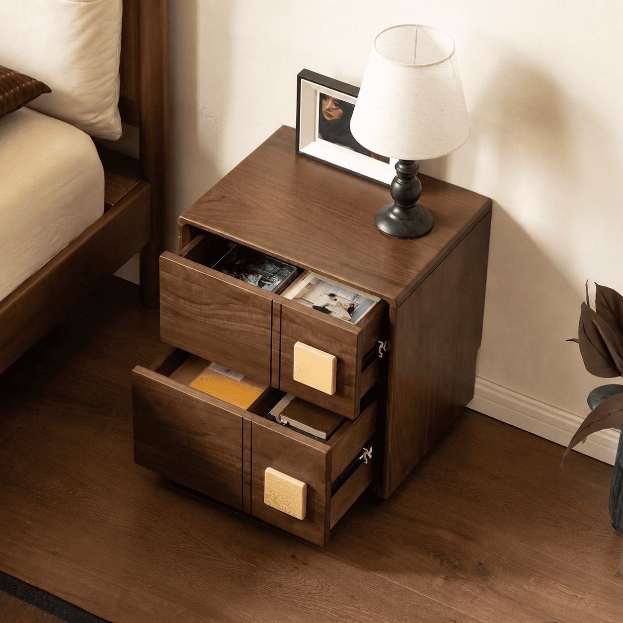 Walnut solid hardwood bedside table with two open drawers showing interior storage space