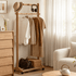 Fukuoka natural solid oak movable coat rack beside window with hanging clothes, hat and handbag