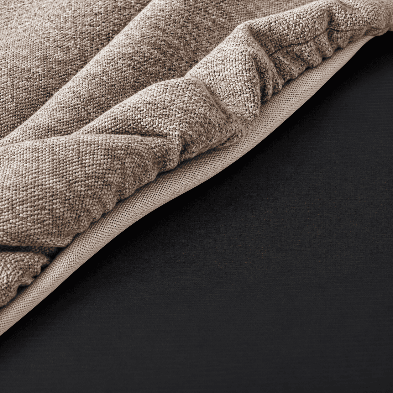 Close up of Graz dressing stool cushion fabric texture and stitched upholstered edge