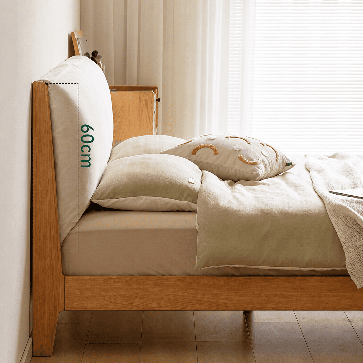 Light oak bed frame with a soft upholstered headboard and contemporary minimalist styling