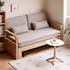 Light oak sofa bed with beige fabric upholstery and a pull-out bed frame
