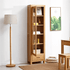 Humbie Solid Oak Slim Display Cabinet with glass door, lower drawer and natural oak finish in a bright living room.