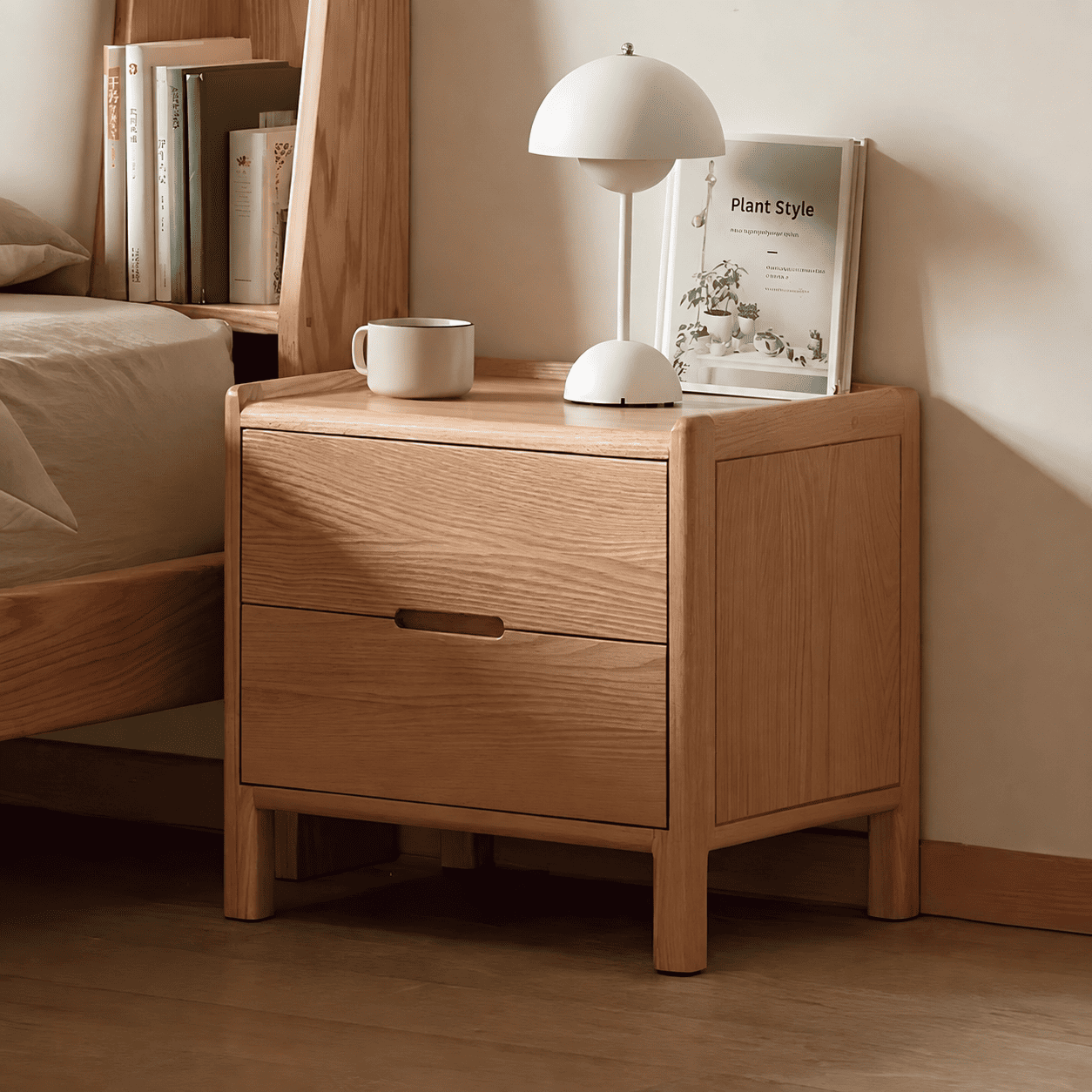 Kusel Natural Solid Oak Bedside Table showing rounded frame, side panel detail and clean three-drawer storage design.