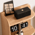 Hand opening the drawer of Lannion Natural Solid Oak Bedside Table with Hutch, showing solid oak finish and practical hidden storage.