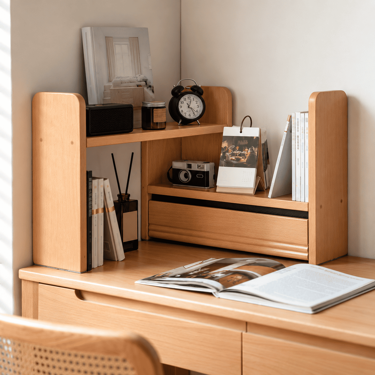 Lathum Natural Solid Beech Desktop Shelf displayed in a study corner with books, calendar, camera and desktop décor
