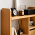 Close-up of Lathum Natural Solid Beech Desktop Shelf showing rounded side panels, open drawer and book storage