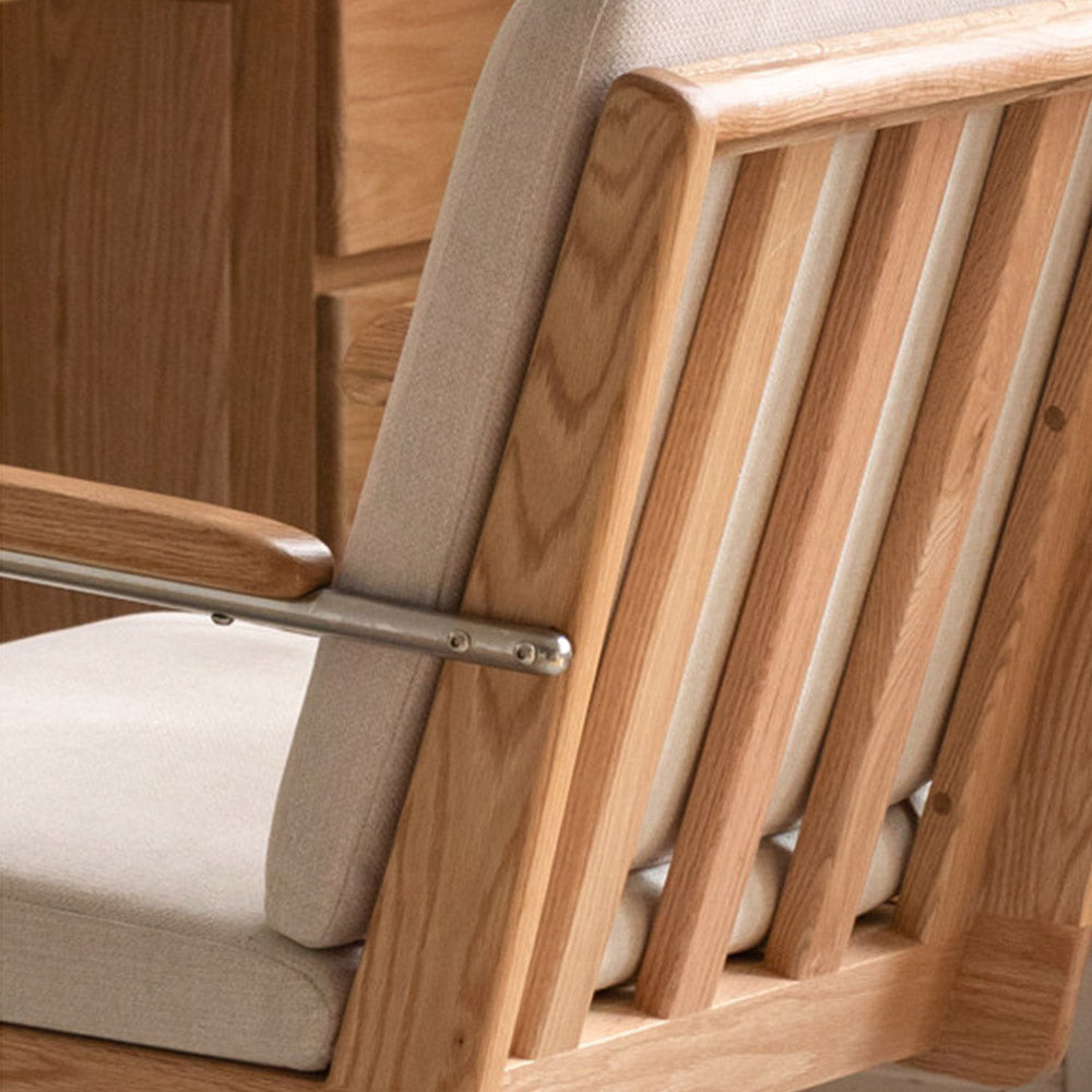 Rear view of Lecca solid oak office chair showing timber frame, upholstered seat, and aluminium wheeled base