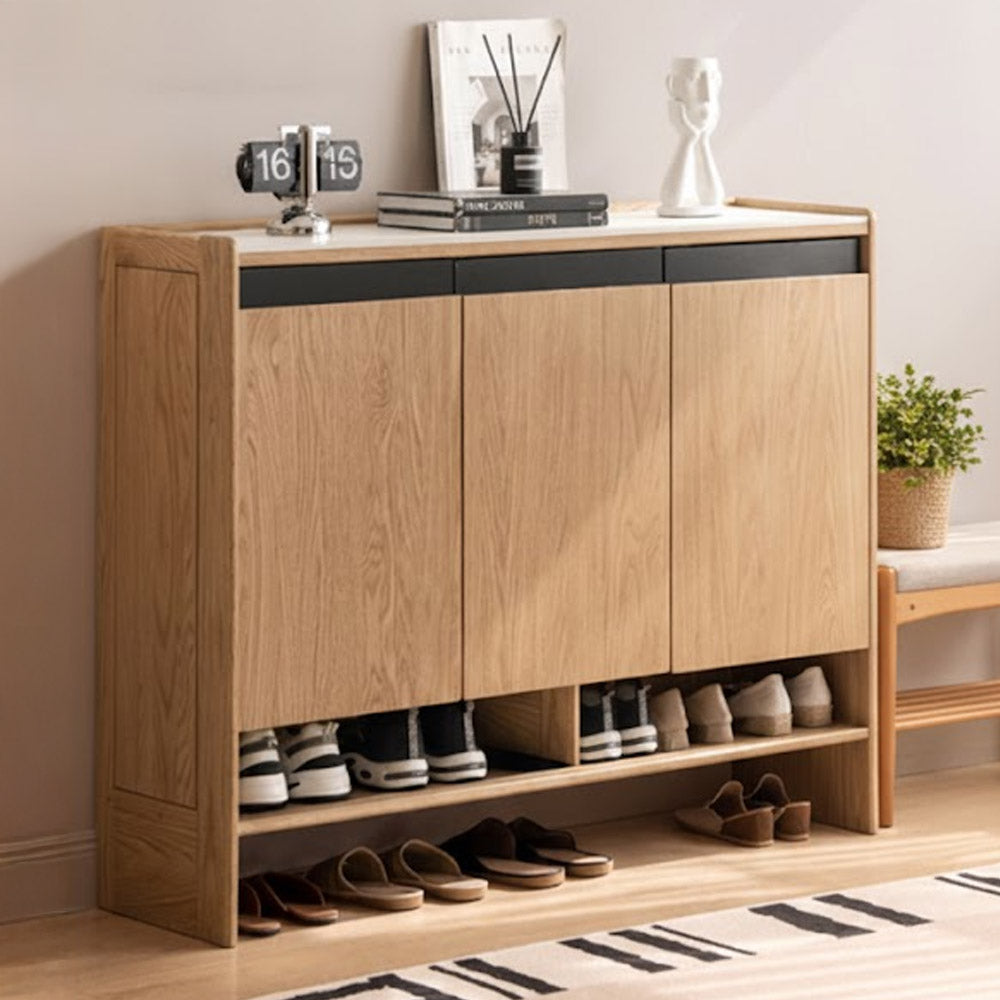 Limina natural solid oak shoe cabinet with white ceramic top, adjustable internal shoe racks and open shoe storage shelves in a hallway