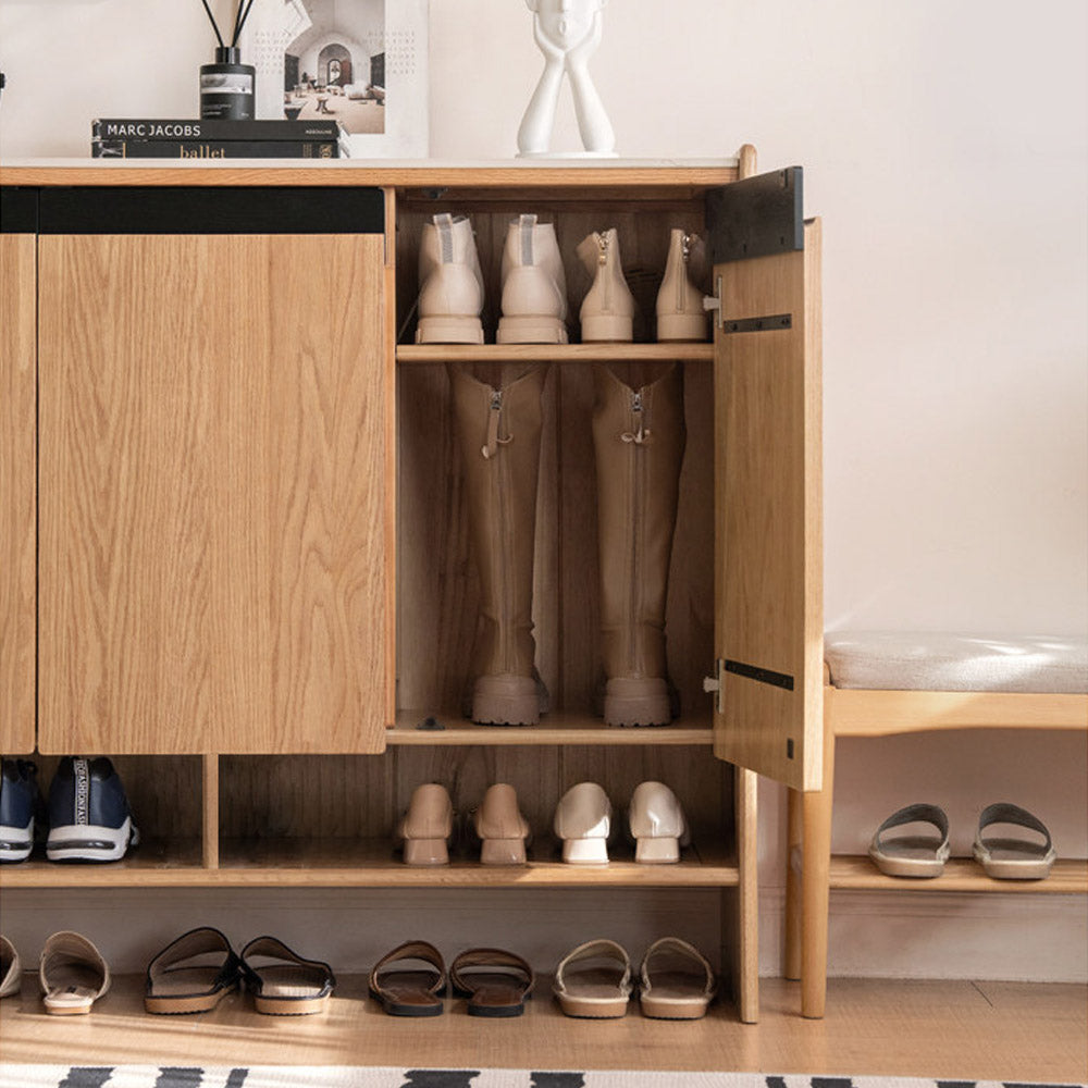 Limina natural solid oak shoe cabinet with white ceramic top, adjustable internal shoe racks and open shoe storage shelves in a hallway