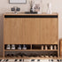 Limina natural solid oak shoe cabinet with white ceramic top, adjustable internal shoe racks and open shoe storage shelves in a hallway
