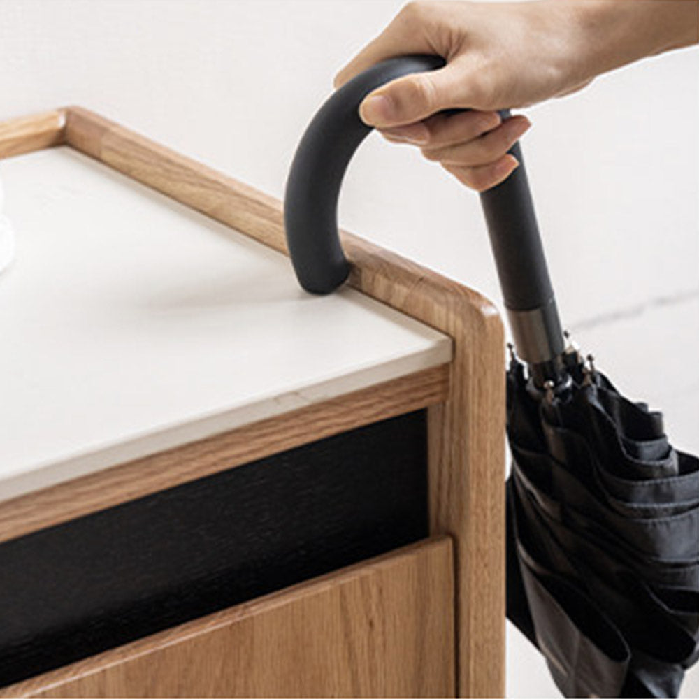 Limina natural solid oak shoe cabinet with white ceramic top, adjustable internal shoe racks and open shoe storage shelves in a hallway