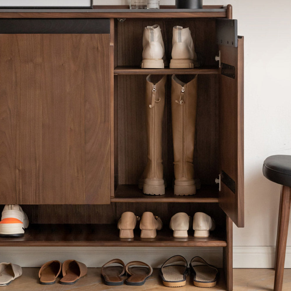 Limina natural solid walnut shoe cabinet with white ceramic top, adjustable internal shoe racks and open shoe storage shelves in a hallway